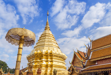Fototapeta premium Public big golden pagoda at Wat Phra That Doi Suthep thai buddhist temple the most famous is visiting place of Chiang Mai, Thailand.
