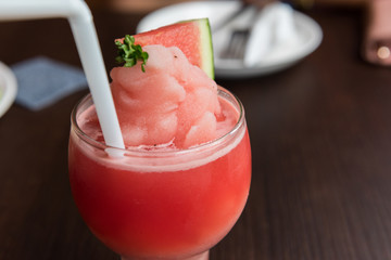 Watermelon smoothie in glass closed up