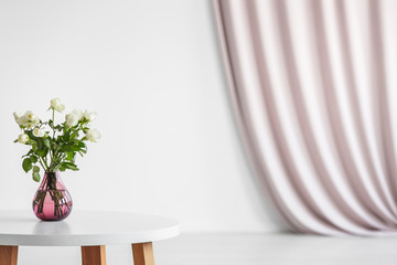 White roses in pink interior