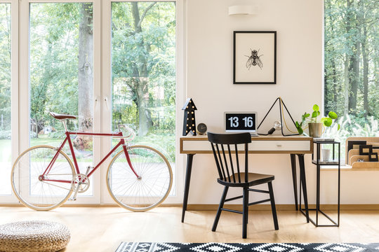 Workspace with red bicycle