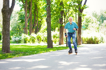 Fototapeta premium Senior man roller skating outdoors