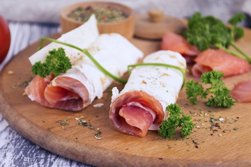 snack salted red fish and spices on the table