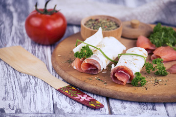 snack salted red fish and spices on the table
