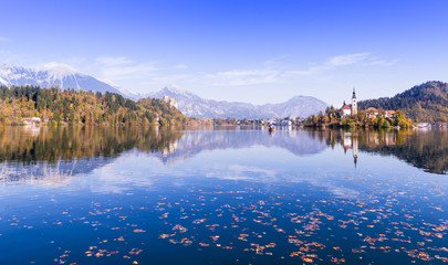 View on Bled Lake, Island,Church And Castle with mountain range on a background. Popular touristic destination, Slovenia, Europe