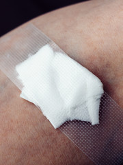 Closeup of bandage on arm after taking blood sample