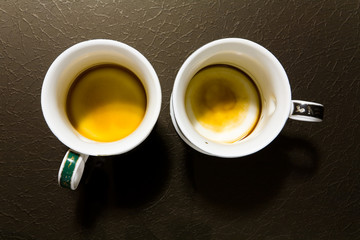 Two empty dirty mugs.