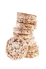 Round wheat crispbread, white background. Composition of crispbread on white background.
