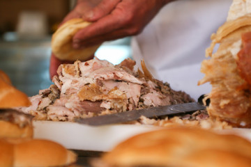 Street food. Sliced meat for a sandwich.