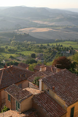 Fototapeta na wymiar Summer. A typical Italian village. Montepulciano. View of the roofs of houses