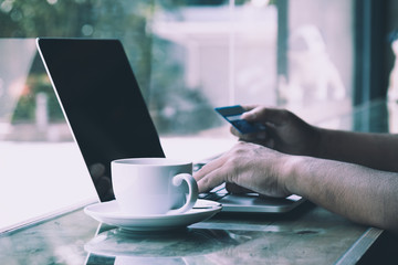 Male customer order goods from internet shopping and pay by credit card