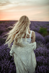 Young woman in white dress on the lavender field