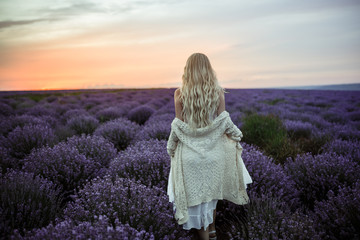 Young woman in white dress on the lavender field