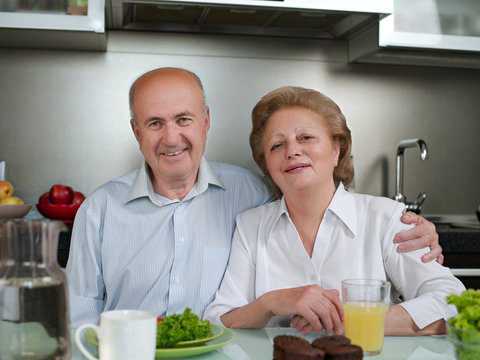 Positive loving aged coupel having breakfast,lunch,dinner