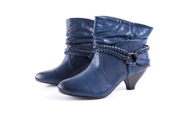 Female blue leather boots on white background, isolated product, comfortable footwear.