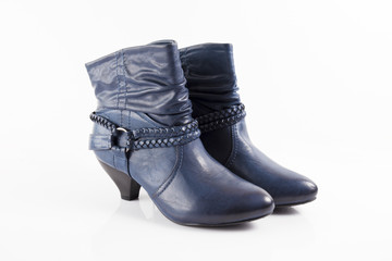 Female blue leather boots on white background, isolated product, comfortable footwear.
