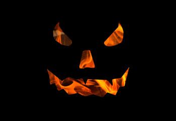 Naklejka premium halloween w tle latarnia jack, straszna tekstura twarzy ognia na czarnej podstawie