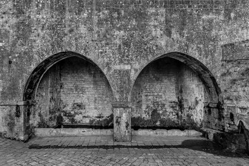Black and white view of the Fonti di Docciola, walls of Volterra, Pisa, Tuscany, Italy