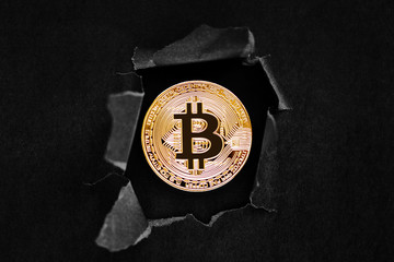 golden bitcoin on a table
