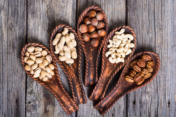 Mix of nuts in wooden spoon