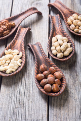 Mix of nuts in wooden spoon