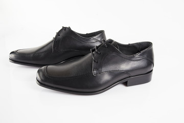 Male black leather elegant shoe on white background, isolated product, comfortable footwear.