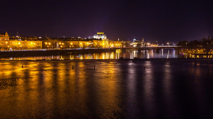 Fototapeta na wymiar The night View on the Prague National Theater above the River Vltava, Czech Republic