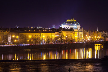 Fototapeta na wymiar The night View on the Prague National Theater above the River Vltava, Czech Republic
