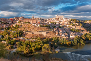Fototapeta na wymiar Panoramic aerial view of Old city of Toledo with Cathedral, Alcazar and river Tajo at dusk, Castilla La Mancha, Spain