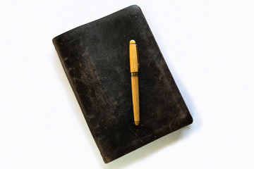 Top view of a journal and pen