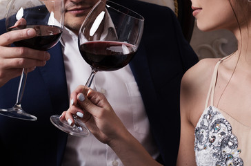 Attractive young couple drinking wine