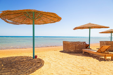 Parasols on the beach of Red Sea in Hurghada, Egypt
