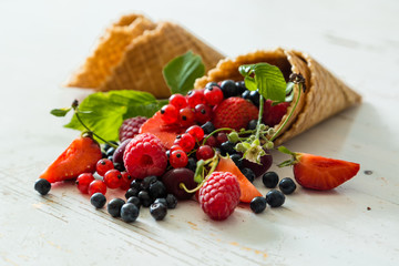 Selection of fresh berries in waffle cones