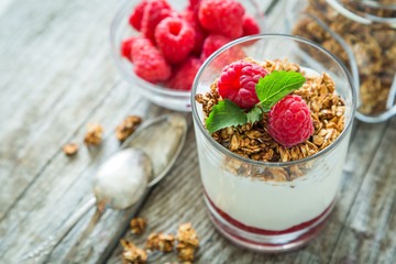 Granola with rasberry and yogurt in glass
