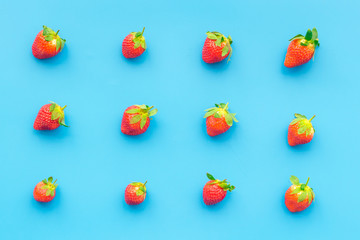 Fresh ripe strawberry. Pattern on blue pastel background top view