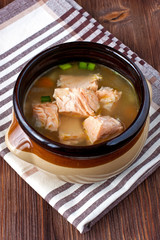 Bowls with salmon soup and veggies
