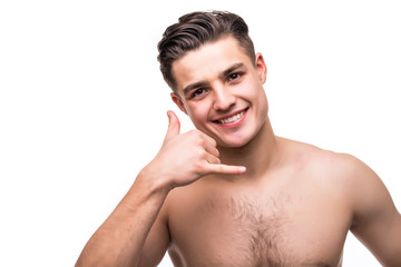 Cheerful handsome undress man gesturing and asking to call him isolated on white background