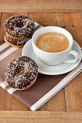 Fresh homemade donuts and coffee mug 