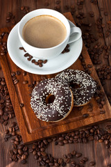 Fresh homemade donuts and coffee mug 