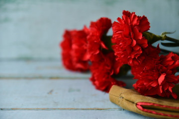 background for postcards by may 9, victory day: cap, letters, carnations and St. George ribbon