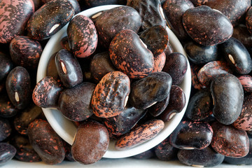 Dried kidney brown speckled beans The concept of proper nutrition and healthy lifestyle. Top view, close-up as background or texture