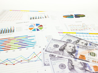 Dollar banknotes with business graphs and report information background for financial and economy...