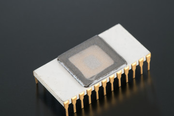 Electronic chip isolated on dark blue
