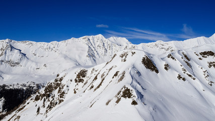 Fototapeta na wymiar panorama invernale dalla cima del pizzo Foisc, nelle alpi Lepontine (Svizzera)