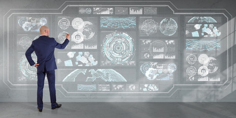 Businessman using graph screens interface on a wall 3D rendering