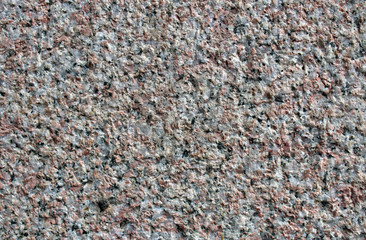 Pink granite rock surface
