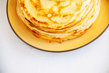 Russian traditional food. Appetizing fried pancakes during Pancake Week