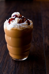 Iced Coffee Caramel Frappe / Frappuccino with Whipped Cream and Caramel Syrup.