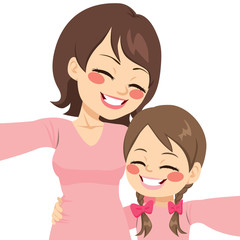 Beautiful mother and daughter happy making selfie together with same pink shirt