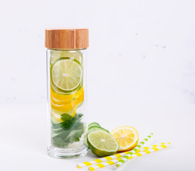 Detox Infused Water with Lemon, Lime,Cucumber and Mint in Sports Glass Bottle on a White Background.Healthy Beverage.Food  diet concept.Vegetarian.selective focus.