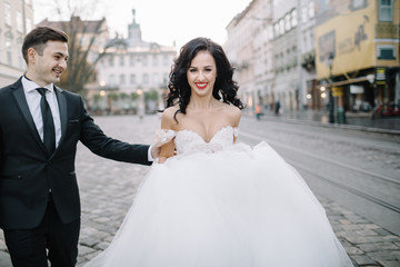 Portrait of a romantic beautiful couple traveler walking in the 